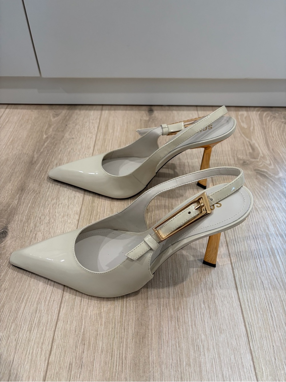 Patent Slingback Pointed Heels in Cream with Gold Buckle